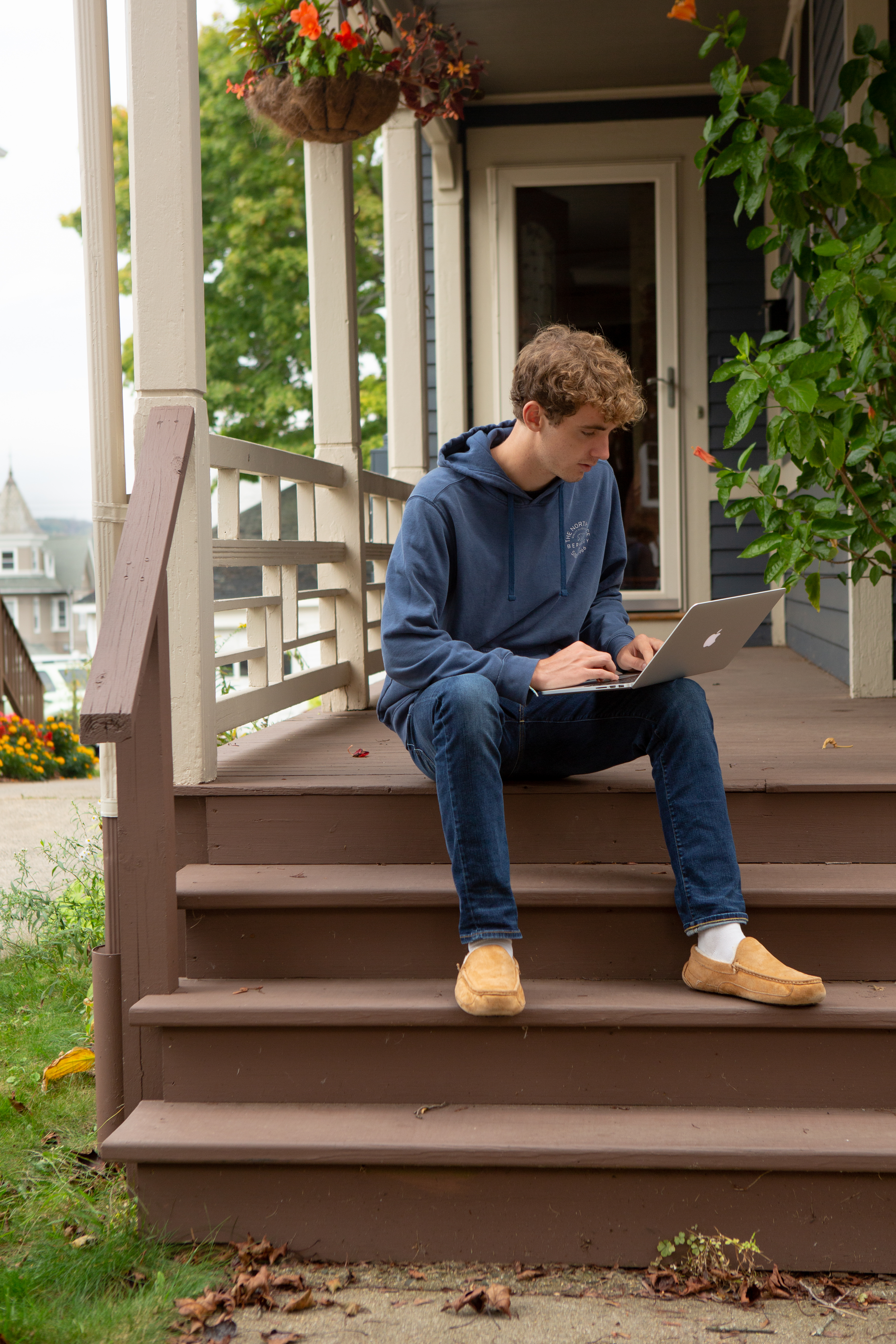 Student doing classrok from home porch photo by Allison Shelley for EDUimages
